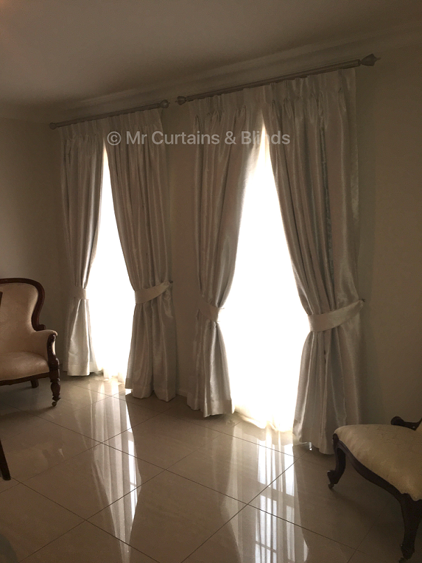 Blockout lined pinch pleat curtains with sheer curtains behind Terrigal home Fabrics Truman and Kasos by Warwick