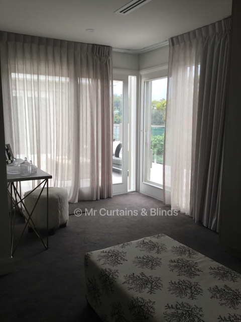Inverted pleat curtains on curved tracking Terrigal home Fabric Capri by Charles Parsons
